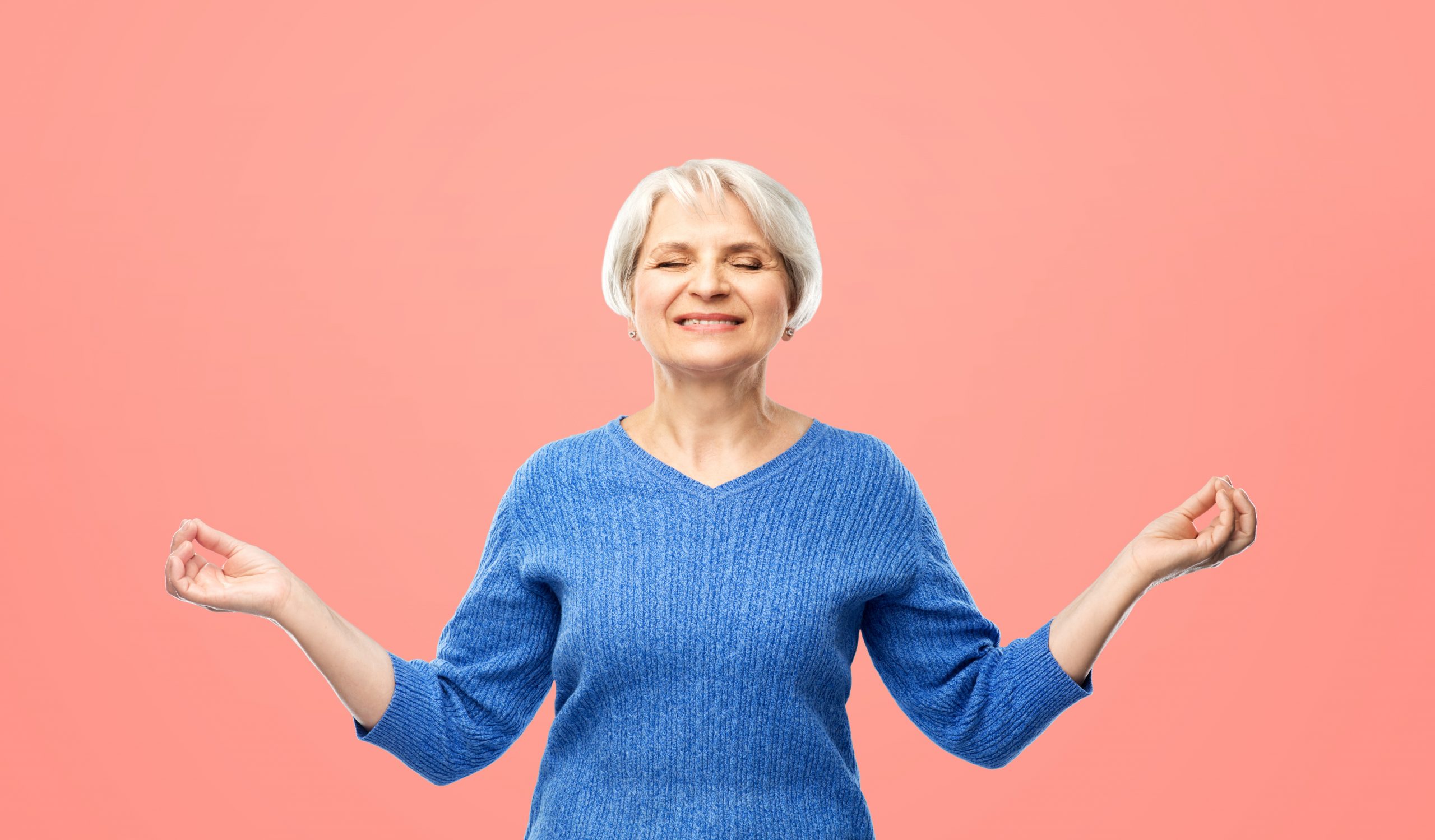 smiling senior woman in blue sweater chilling